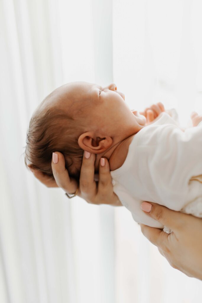 profile of baby yawning. Carmel newborn photographer