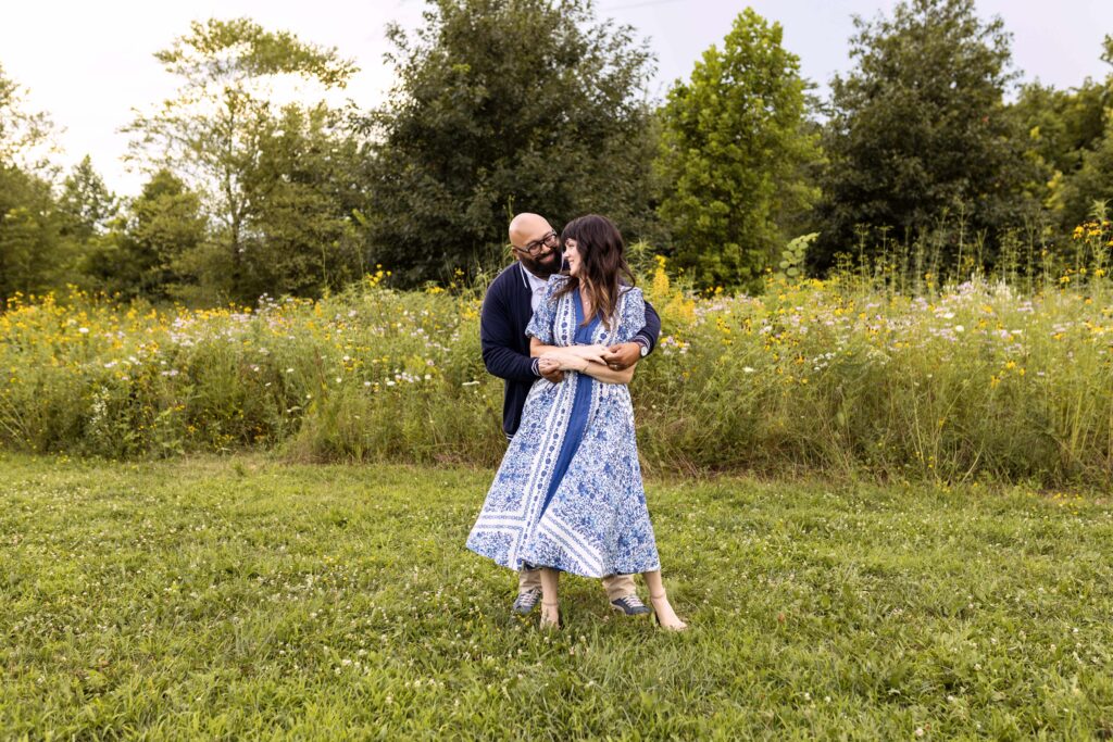 A couple dancing in a field of flowers. Indianapolis family photographer. 
